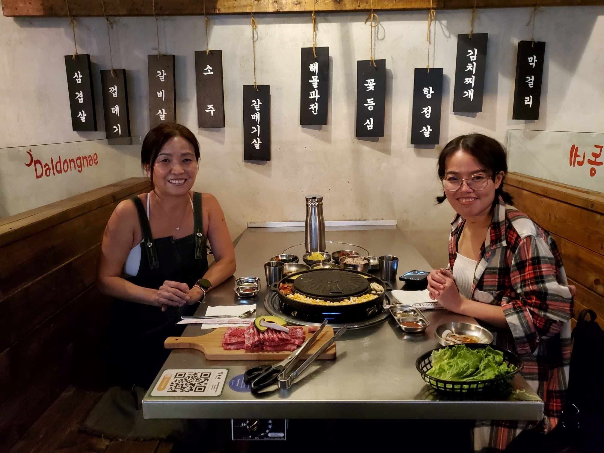 Thao Pham (right) enjoys a meal of Korean barbecue with Scarlett Seo, a former Niagara Health intensive care unit nurse. The two women stayed in touch after Pham spent eight months in hospital in Niagara recovering from tuberculosis. 