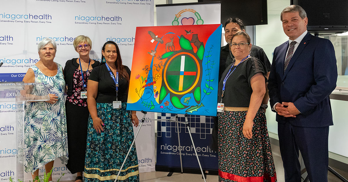 From left: Board Chair Bunny Alexander, President and CEO Lynn Guerriero, Manager of Indigenous Health Services and Reconciliation Charity Beland, artist Delbert (JayR) Jonathan, Indigenous Relations Specialist Jolene Courchene and Niagara Centre MP Vance Badawey Parliamentary Secretary to the Minister of Indigenous Services.