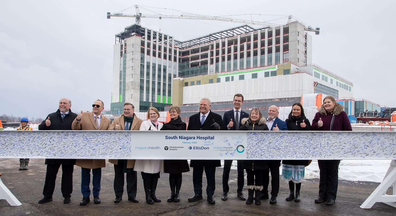Elected officials and community partners joined Niagara Health for a beam signing celebration at the South Niagara Hospital on Wednesday. From left to right: Bob Gale, Chair of Niagara Region; Jim Diodati, Mayor of Niagara Falls; Todd McCarthy, Acting Minister of Infrastructure; Sylvia Jones, Deputy Premier and Minister of Health; Lynn Guerriero, President and CEO of Niagara Health; Premier Doug Ford; MPP Sam Oosterhoff, Niagara West; MPP Jennie Stevens, St. Catharines; Frank Campion, Mayor of Welland; Shyann Jenkins, Indigenous Relations Specialist at Niagara Health; and Andrea Scott, President and CEO, Niagara Health Foundation.
