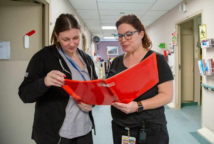 RPN Carolle Vaillancourt answers questions for a nurse at the Welland Hospital