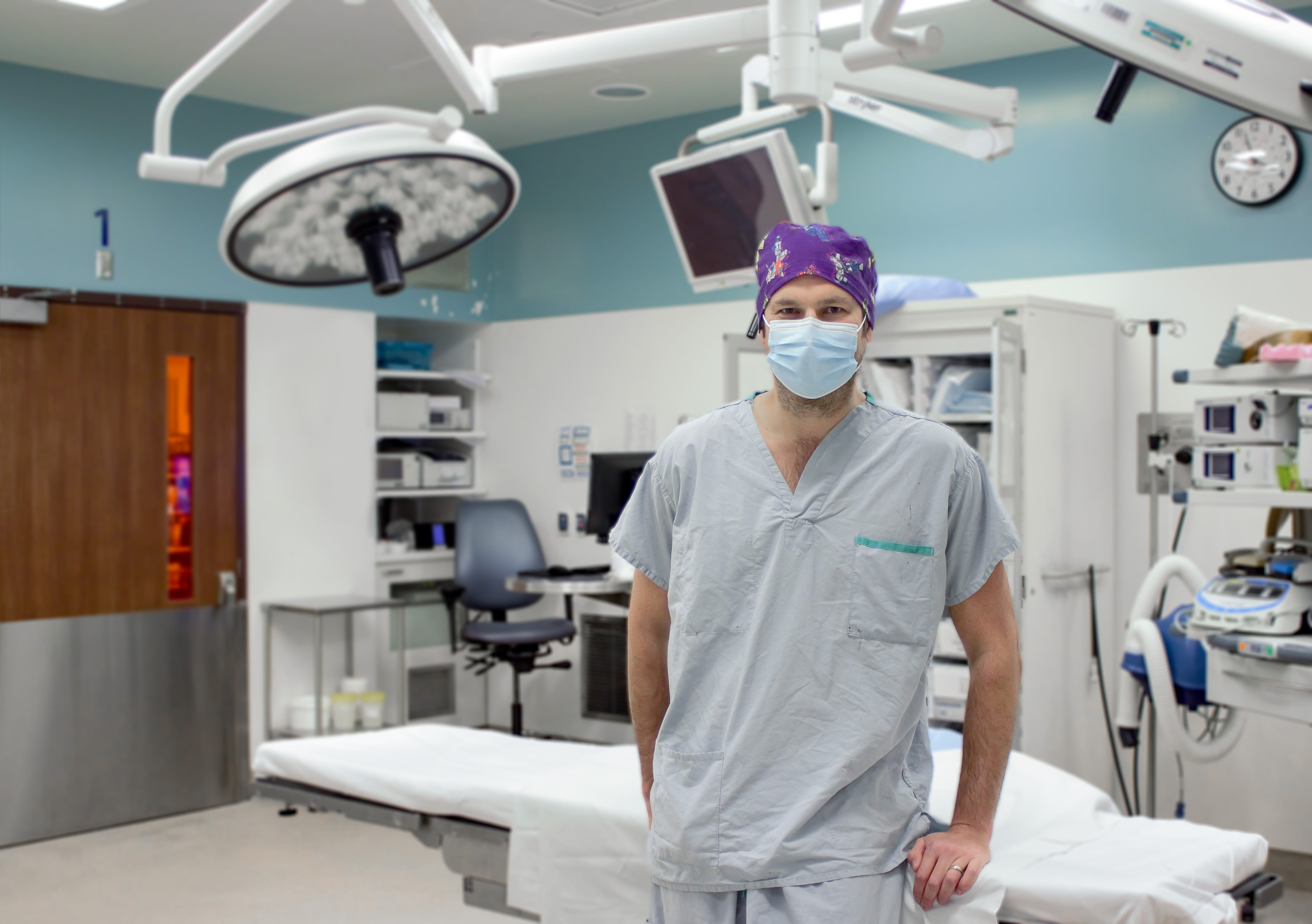 Dr. Liam Beedling stands in an operating room at Niagara Health.