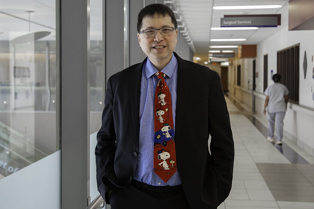 Dr. Kevin Chan stands in a hospital hallway at Marotta Family Hospital