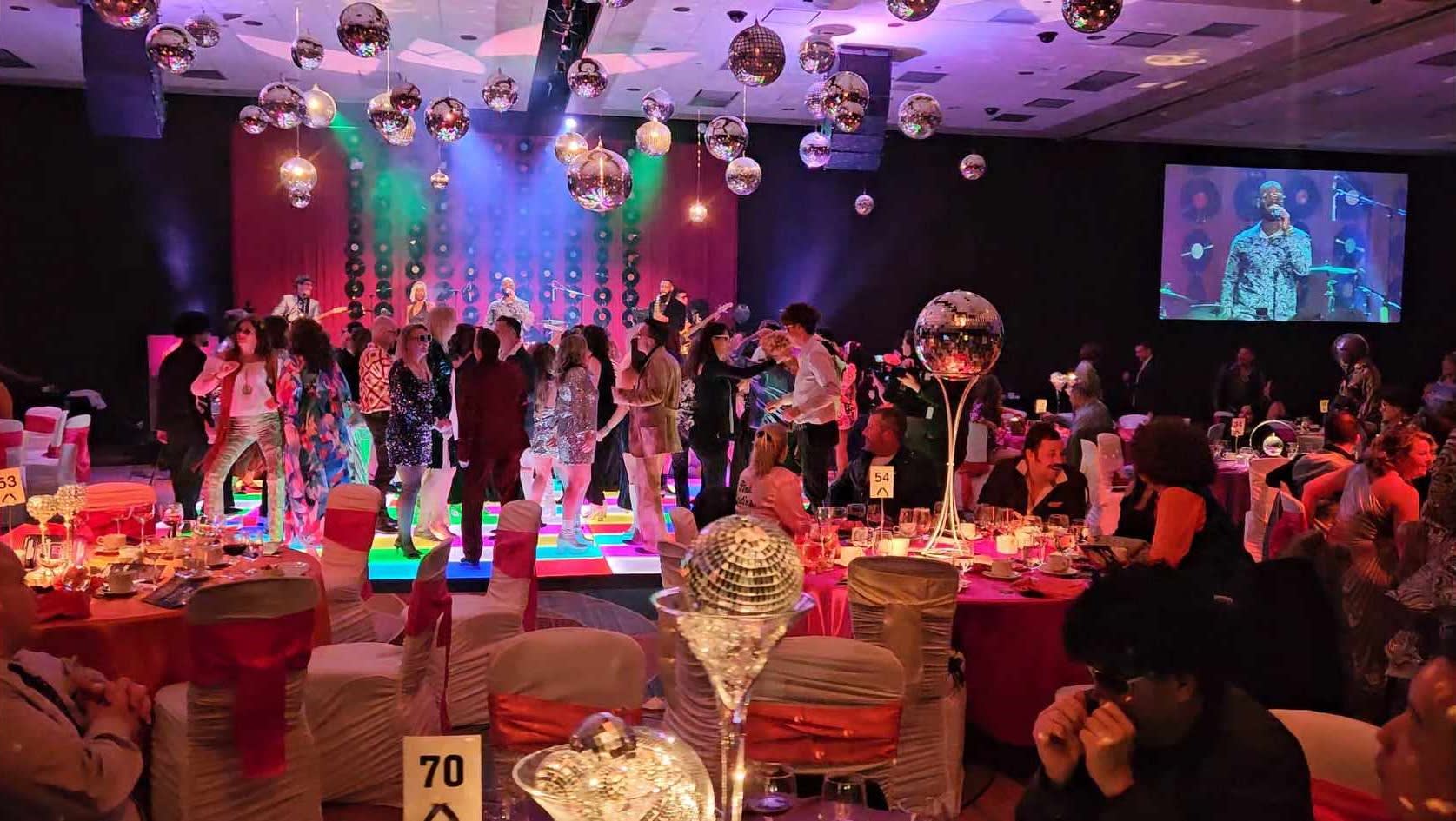 People dance at the Niagara Health Foundation 70s themed gala.