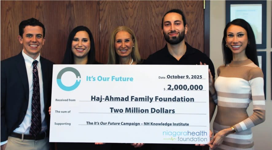 Members of the Haj-Ahmad Family Foundation with a giant cheque for $2million