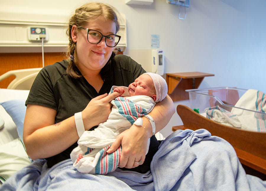 Rachel McColeman and baby Rory in a hospital room.