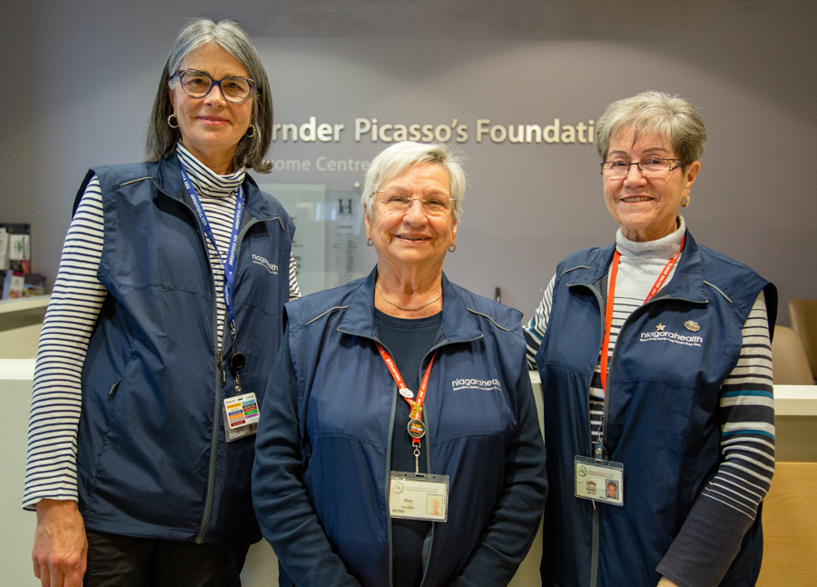 Moira Beedling, Mary Frisano and Joanne Brown are volunteers at the St. Catharines Site Welcome Desk