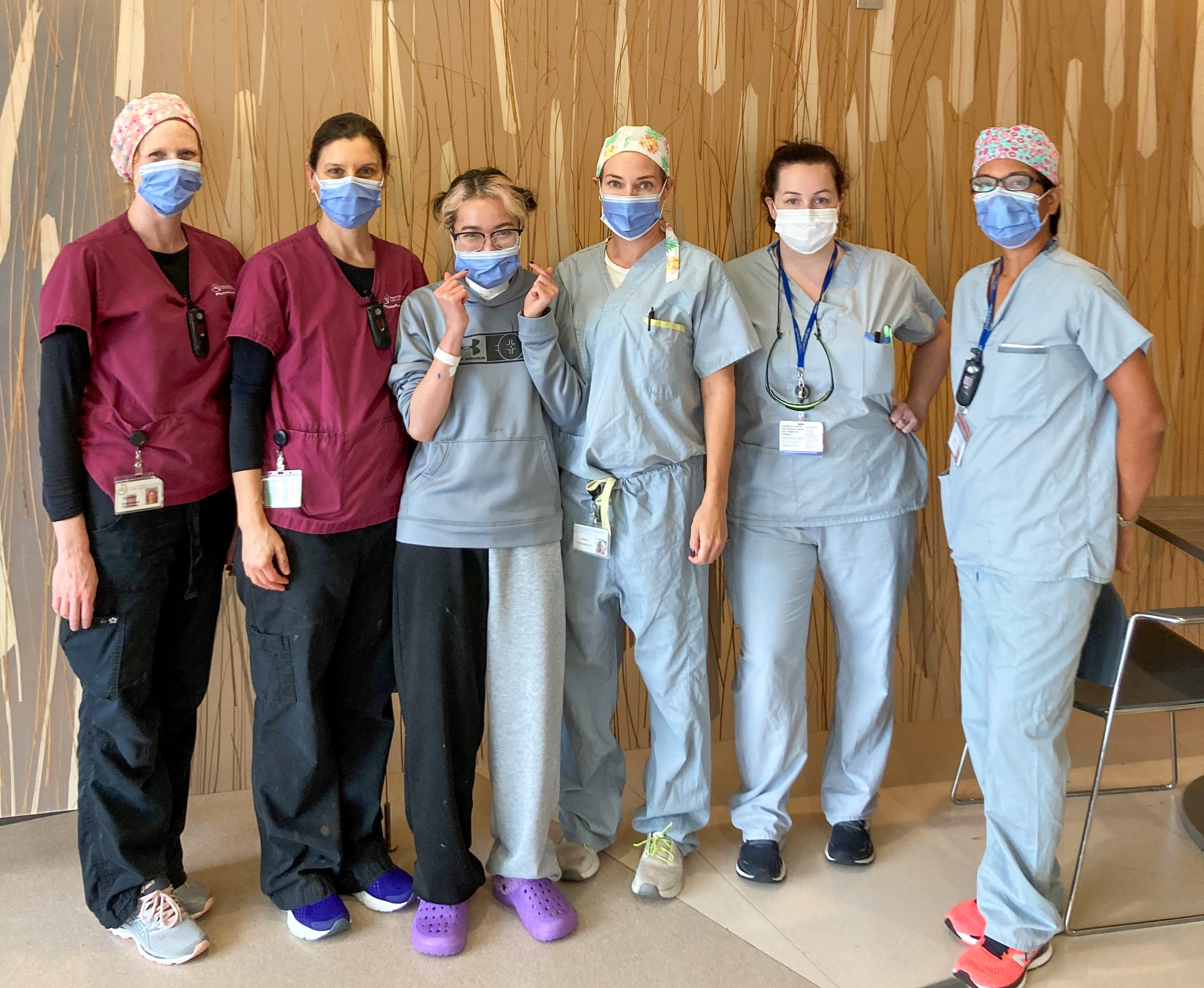 Thao Pham (third from left) stands with her rehab team at the St. Catharines hospital. They are (from left) Elizabeth Bitzer, Sylvie LeBlanc, Angela Santelli, Patricia Doyle and Kathleen Reardon.