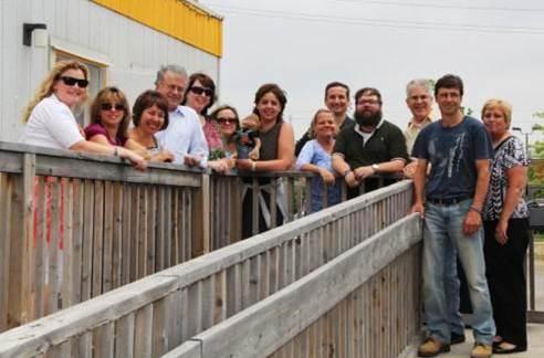 Members of the NHS’ New Hospital Project Management Team gather one last time outside of the trailer complex.