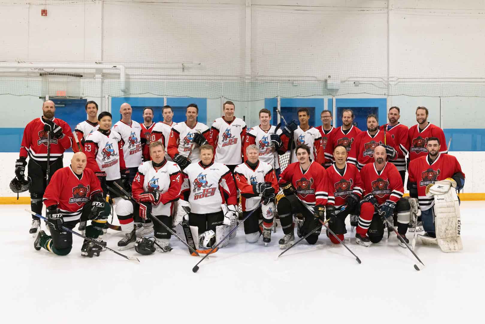 Niagara Ice Docs and Defibrillators combined team photo on ice